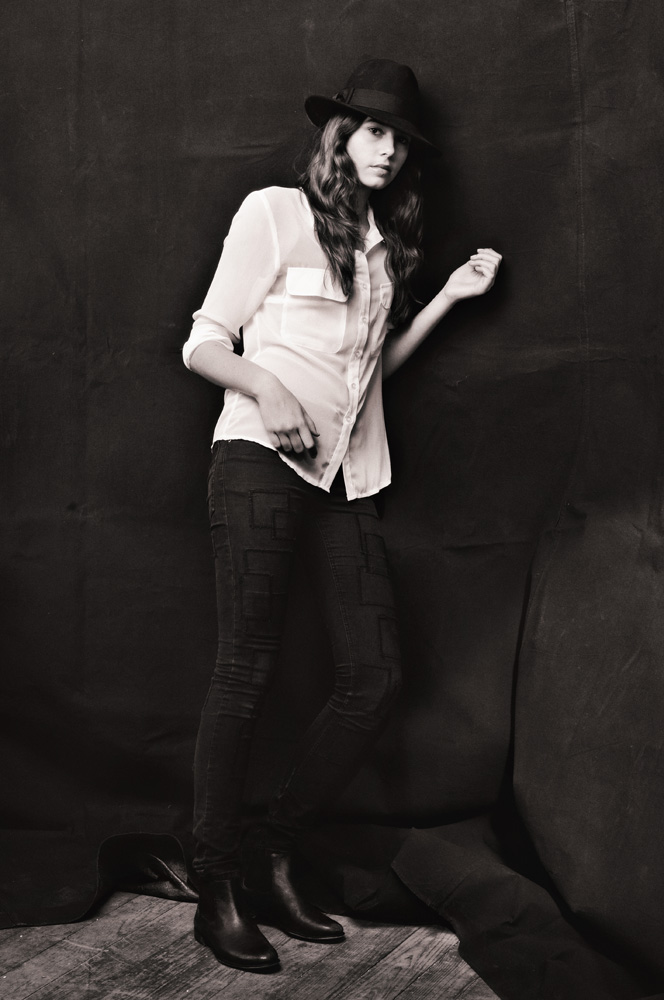 Studio Fashion Portrait, teen agency model photographed against black canvas backdrop.