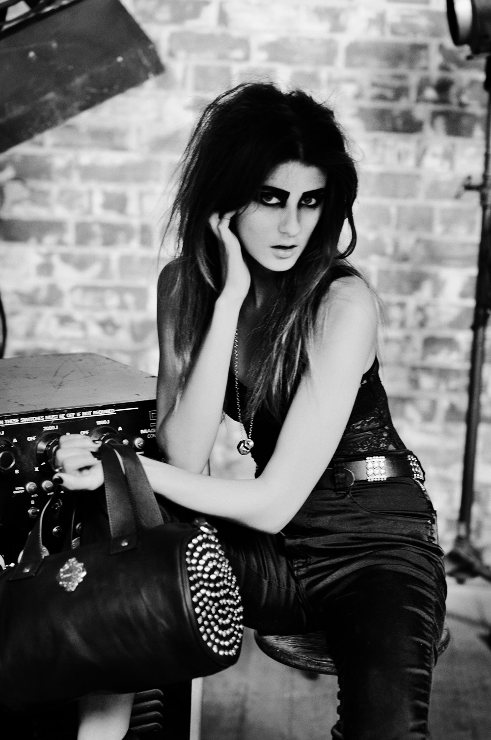 Sydney fashion model photographed with Tank bag in black and white. Biker fashion inspired handbag branding campaign. Photography by Kent Johnson.