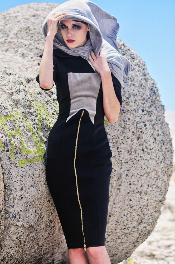 Fashion Editorial Sydney by Kent Johnson, Black dress grey panel long zipper -  The Girls Who Fell To Earth, against the concrete bollard