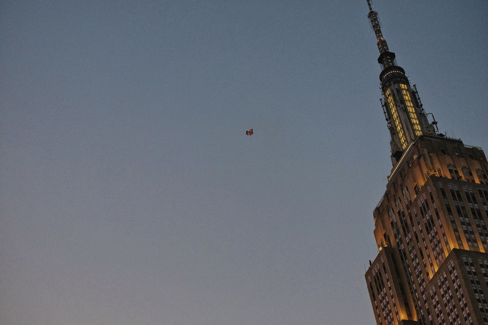 Empire State Building and Ballons at twilight, NYC, USA.