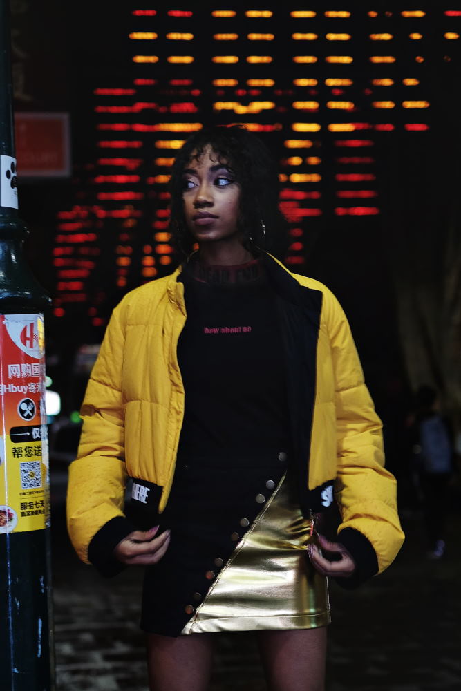 yellow parka, night location with neon for Somewhere Label. Photography by Kent Johnson.