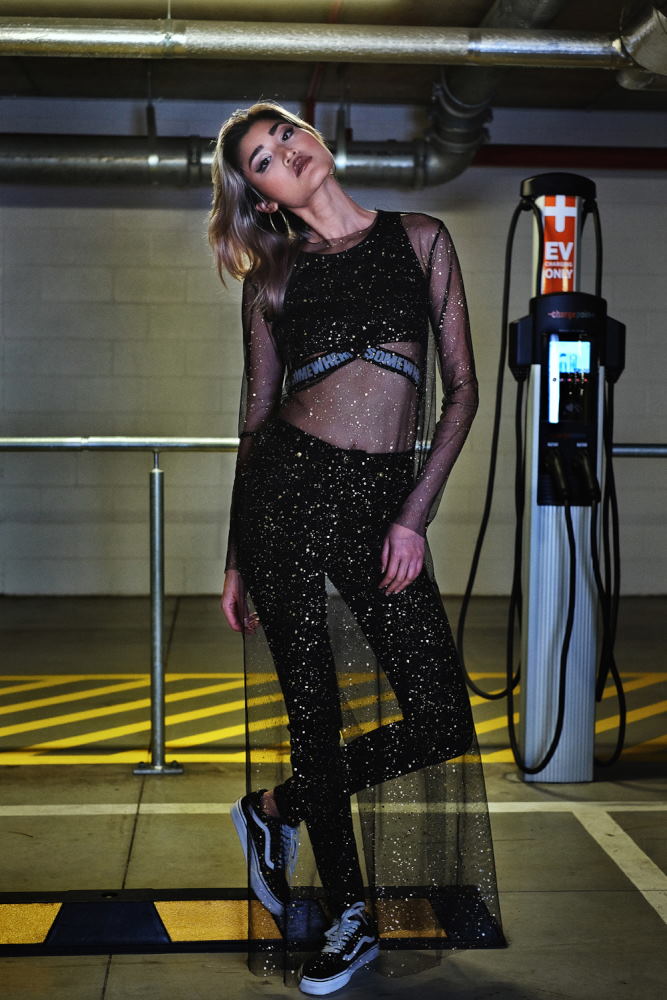 Two young women in activewear fashion in an undergound carpark - Commercial and editorial fashion photographer in Sydney