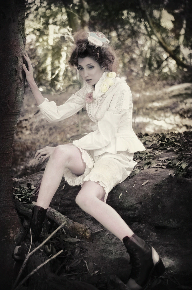 Model in edwardian inspired garments, bushland setting fashion photo.