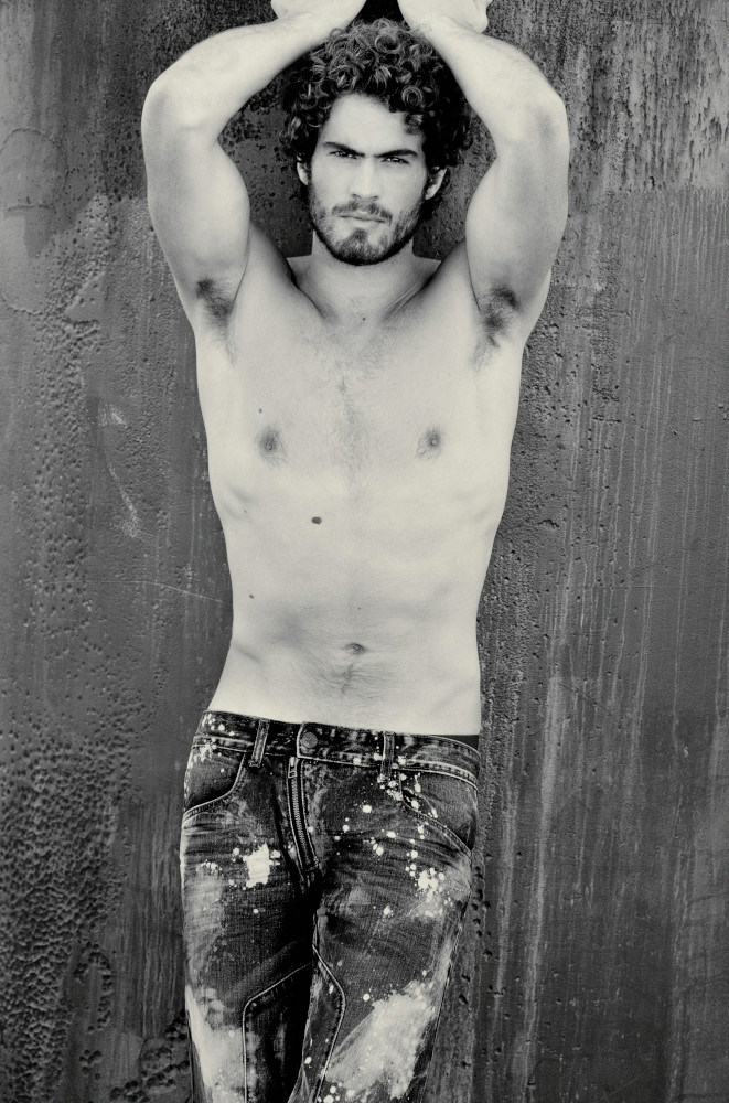 Male model, distressed jeans fashion campaign.