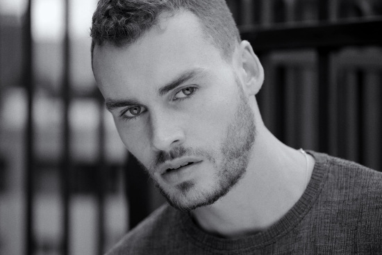 Mason from IMG models, tight horizontal headshot in Black and White, urban Sydney location. Male model photoshoot on location, Sydney, Australia.