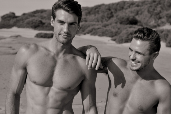 Two male models in sand dunes, black and white photoshoot for Mens grooming products. Male modelling, Sydney, Australia.
