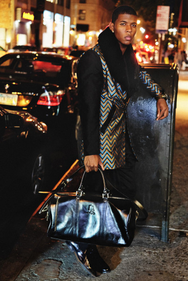Male model with attitude wearing chevron coat, NYC at night.