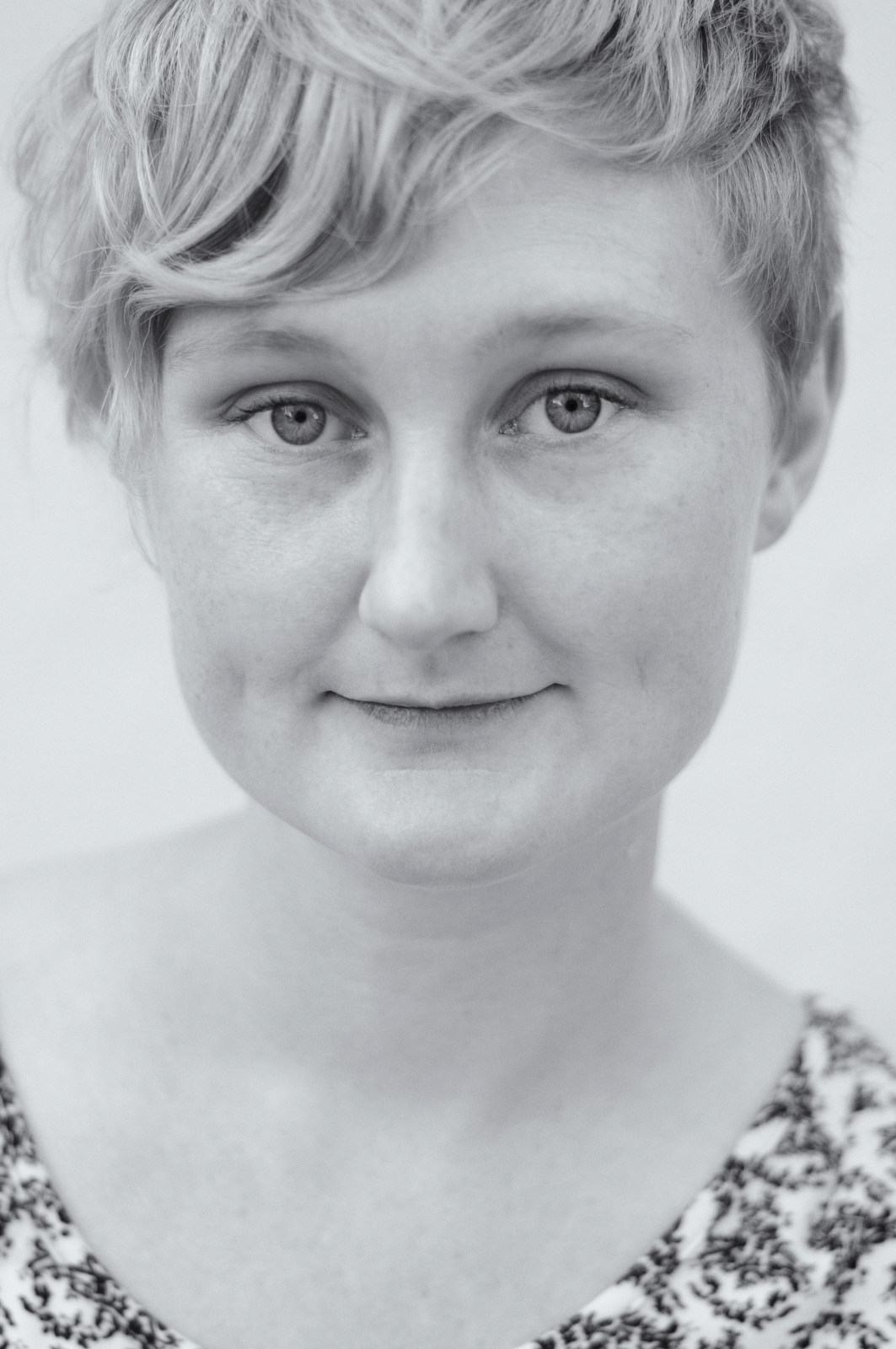 Performer Carolyn Eccles, black and white headshot. Photographed by Kent Johnson.