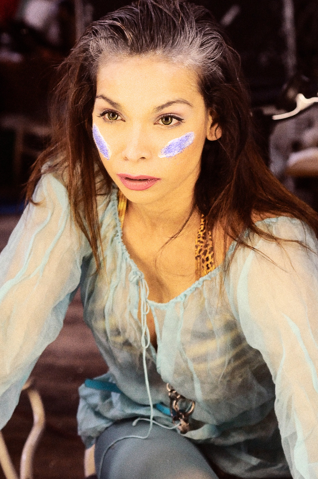 Writer, actor, director, Sage Godrei, looking into the make-up mirror. Studio portrait by Kent Johnson.