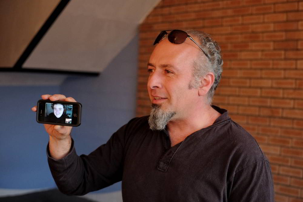 Artist portrait of Gary Deirmendjian and John Adair (on Phone in UK) at Factory 49, Sydney