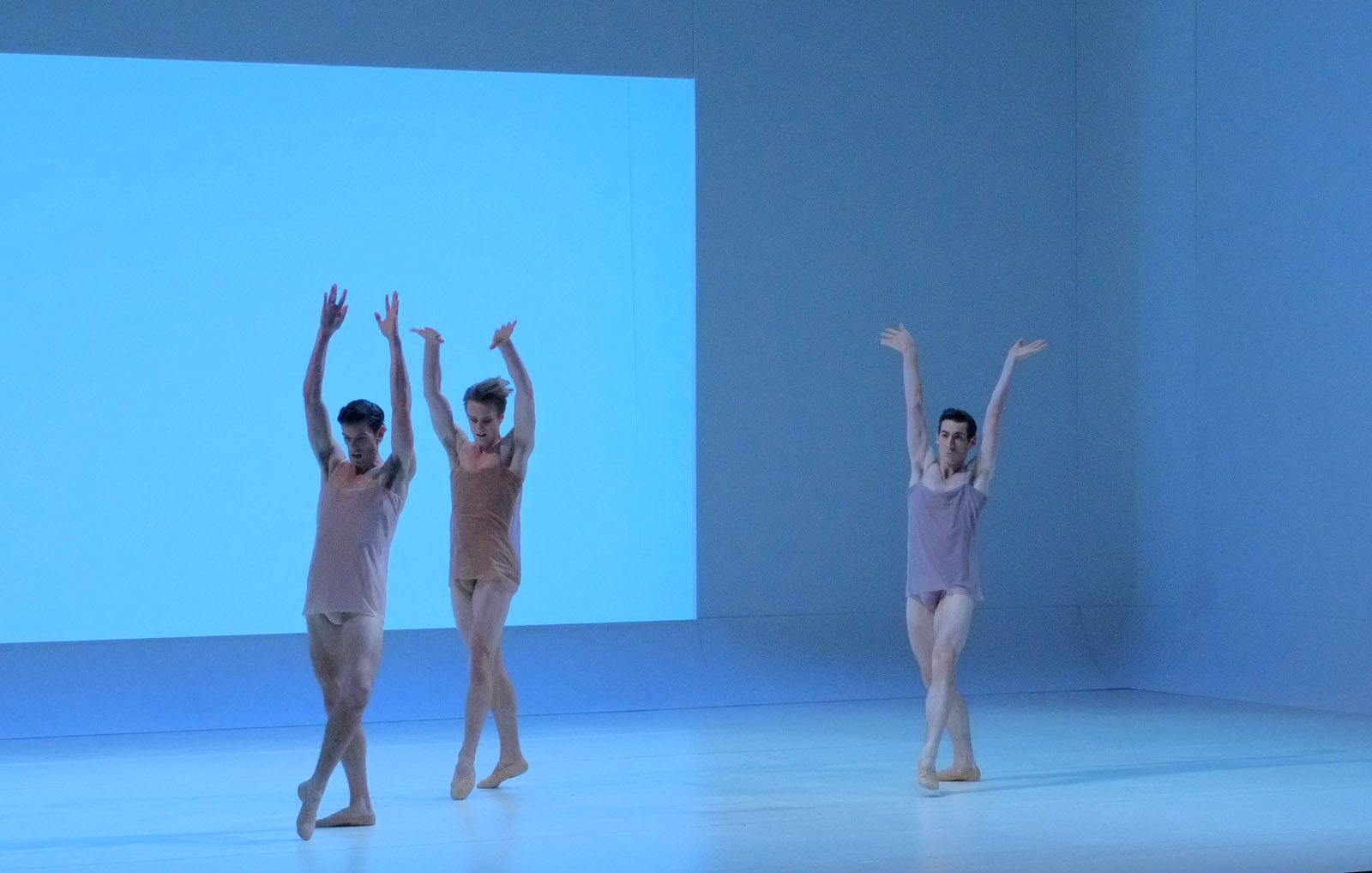 Three male dancers, full extension, The Australian Ballet - CHROMA - Chorographer Wayne McGregor Photography by Kent Johnson.