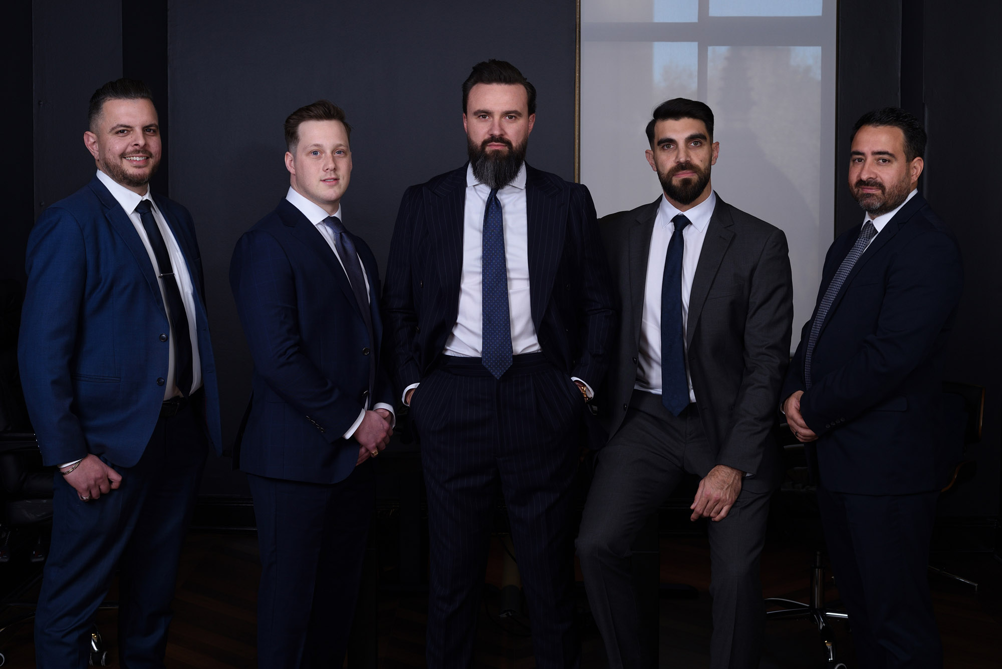 Business portrait, Board of Directors, group of men in dark charchoal office  - Fashionable studio business portraits by Kent Johnson.