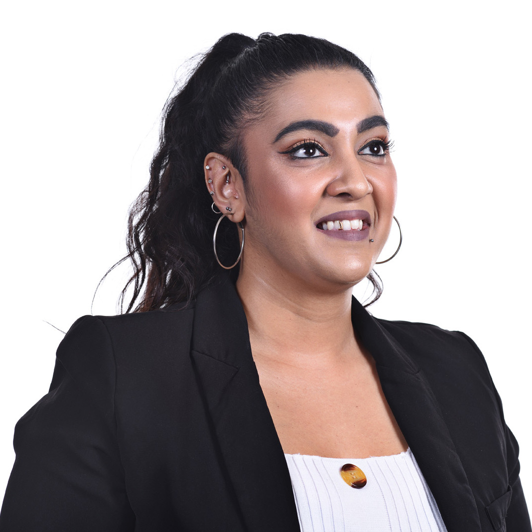 Woman in business suit, corporate Headshots photographed with an onsite studio by Kent Johnson.