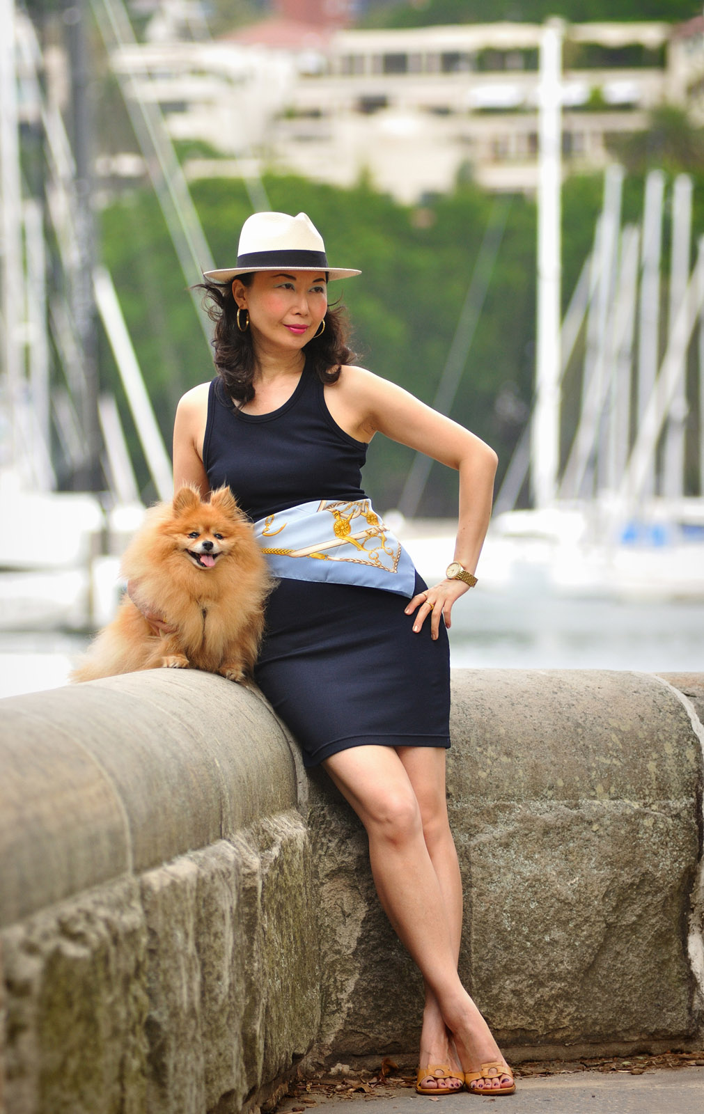 An elegant asian woman with a Pomerainin dog photographed at Rushcutters Bay Park, Sydney, Australia, portrait by Kent Johnson Photography, Sydney, Australia.