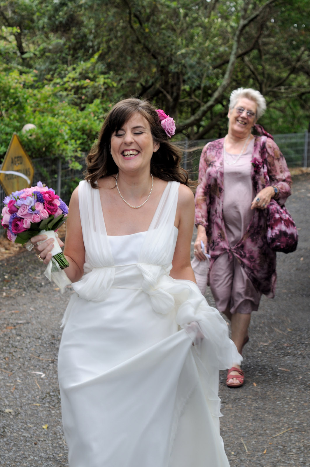 Bride and her mother arriving at the wedding location at Strickland House, Sydney Australia. Wedding portrait by Kent Johnson Photography, Sydney, Australia.