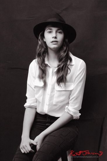 Contemporary studio, teen fashion portrait with dark background. Photographed by Kent Johnson.