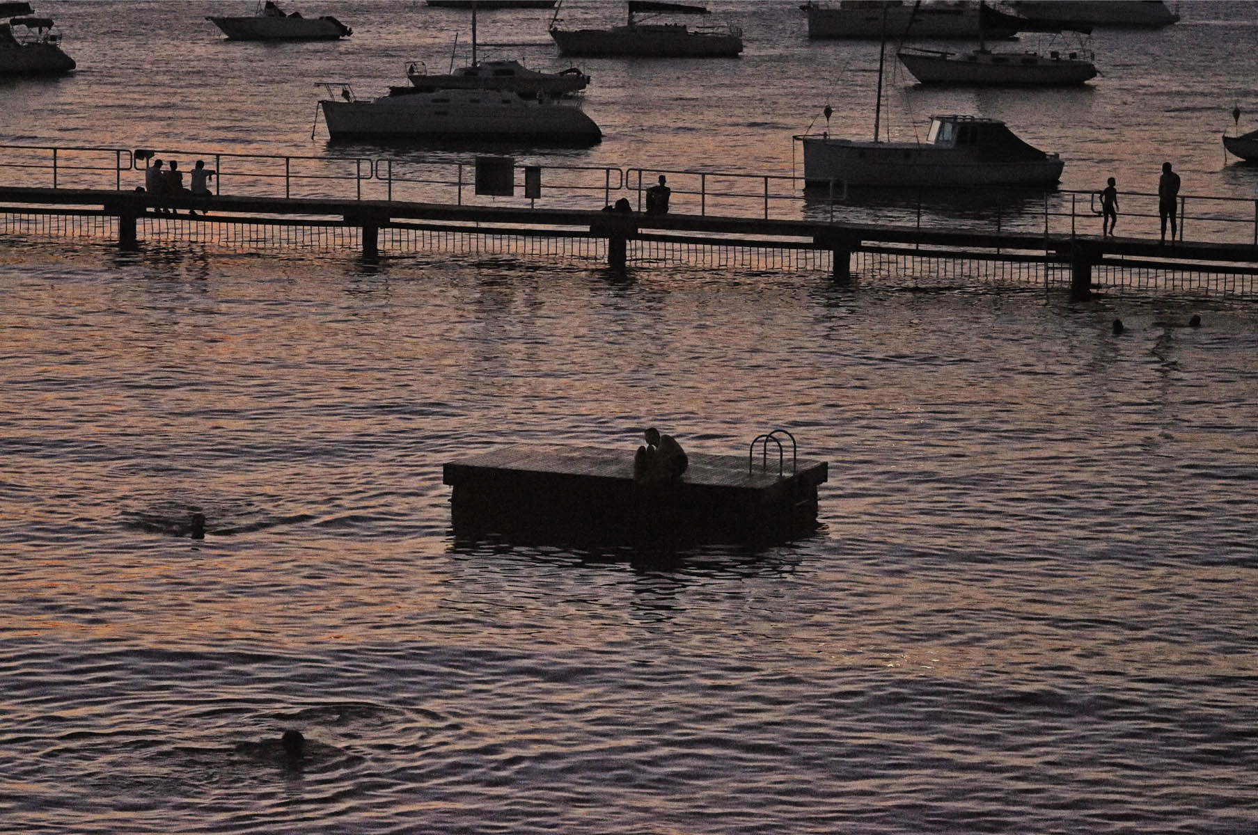 Silhouette swimmers - Redleaf Boulevardier, Impressions of Redleaf Sydney an art exhibition of photographs by Kent Johnson