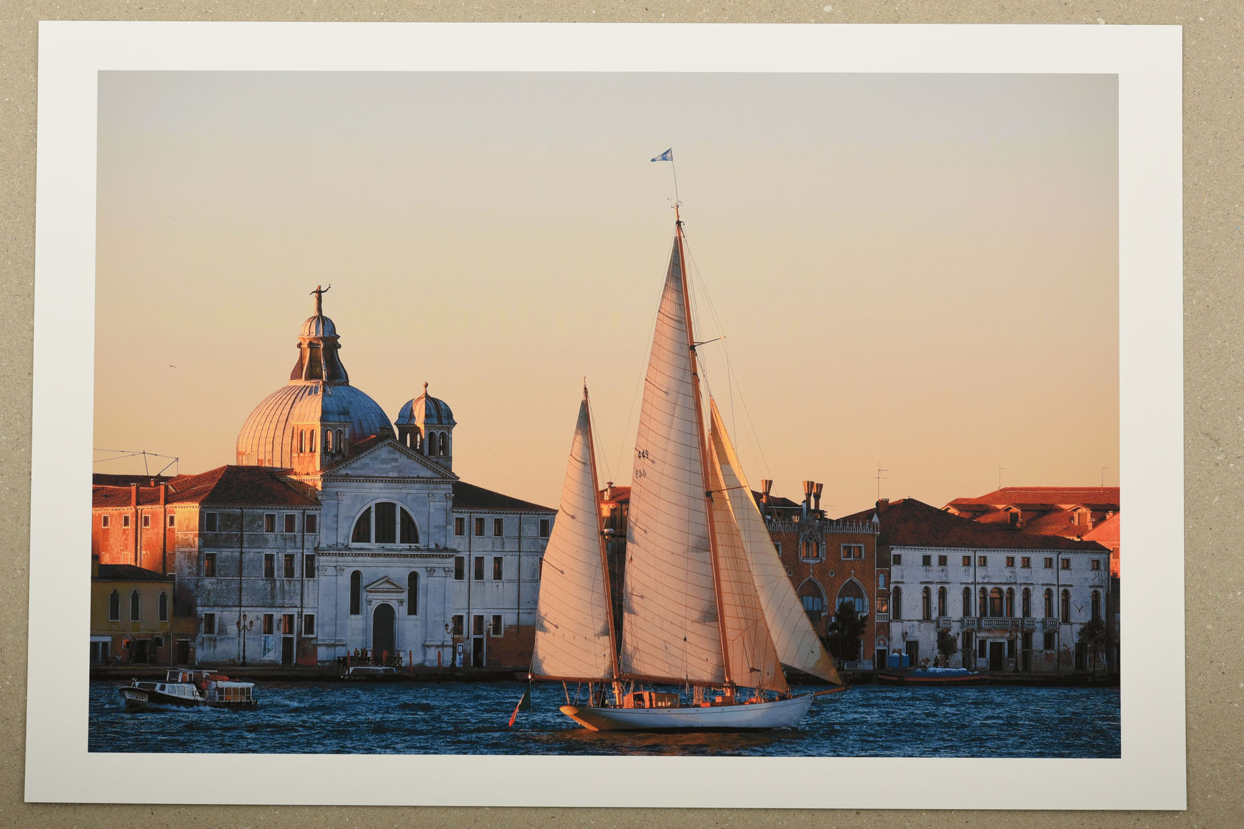 Print of a yacht sailing past Santissimo Redentore at dawn, Venice, Italy. La Serenissima an exhibition of photographs and fine art prints by Kent Johnson