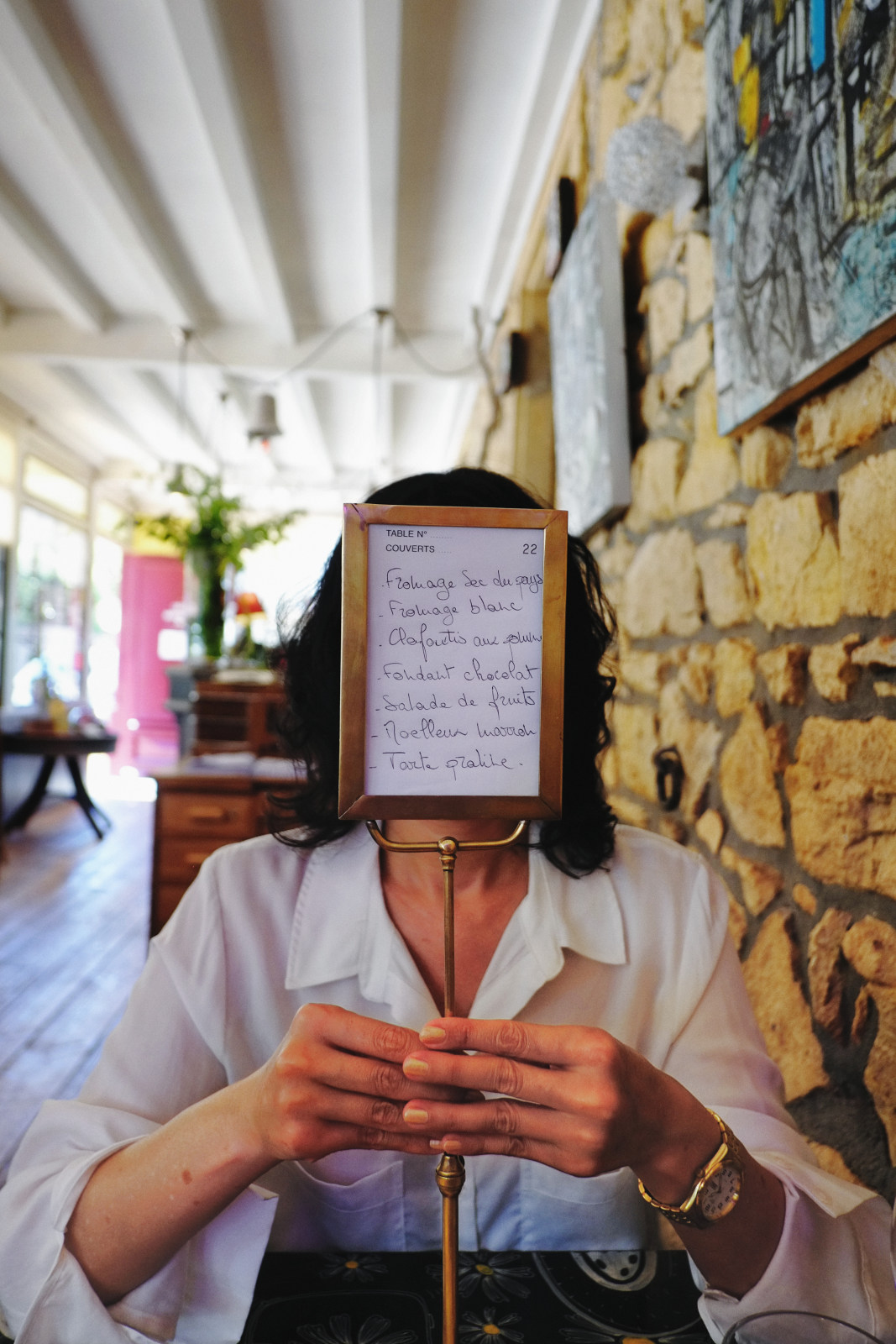 Viv with the dessert menu at Chez Marguerite in Oingt - Photography by Kent Johnson.