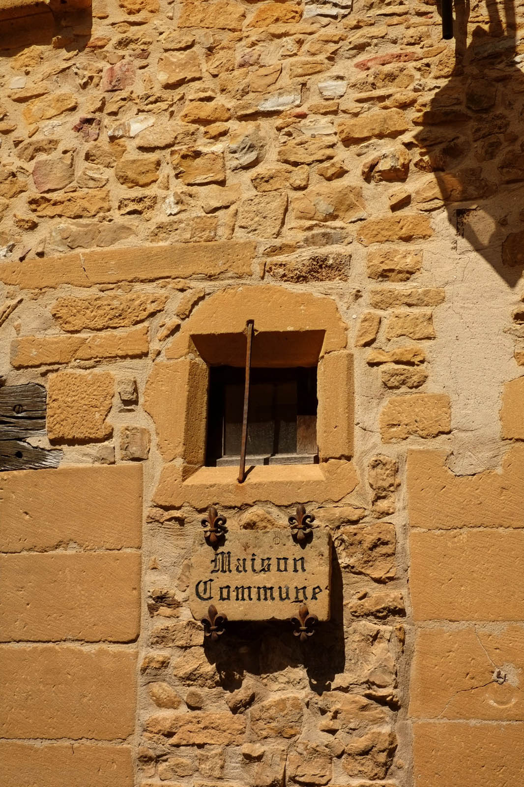 Golden stone architectural detail Maison Commune, Oingt France. Architectural heritage photography by Kent Johnson.