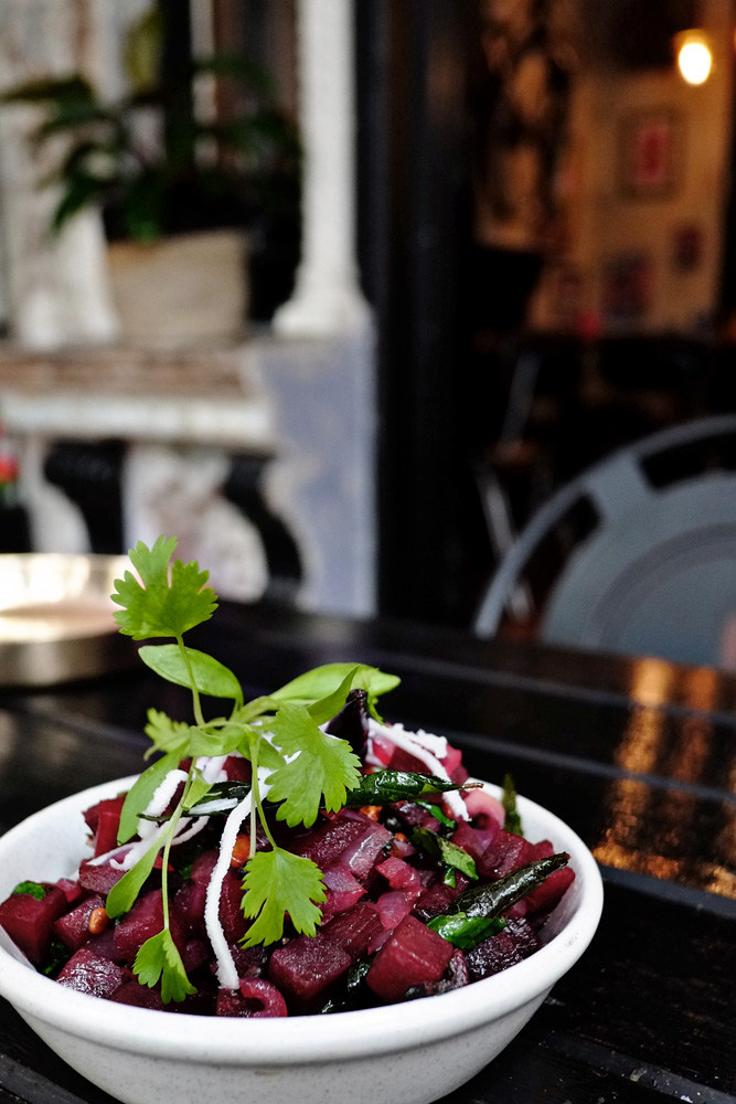 Beetroot Poriyal on the front veranda at Masala Theory, Surry Hills, Beetroot, mustard seeds, chillies, lentils, coconut. Photographed by Kent Johnson for Street Fashion Sydney.