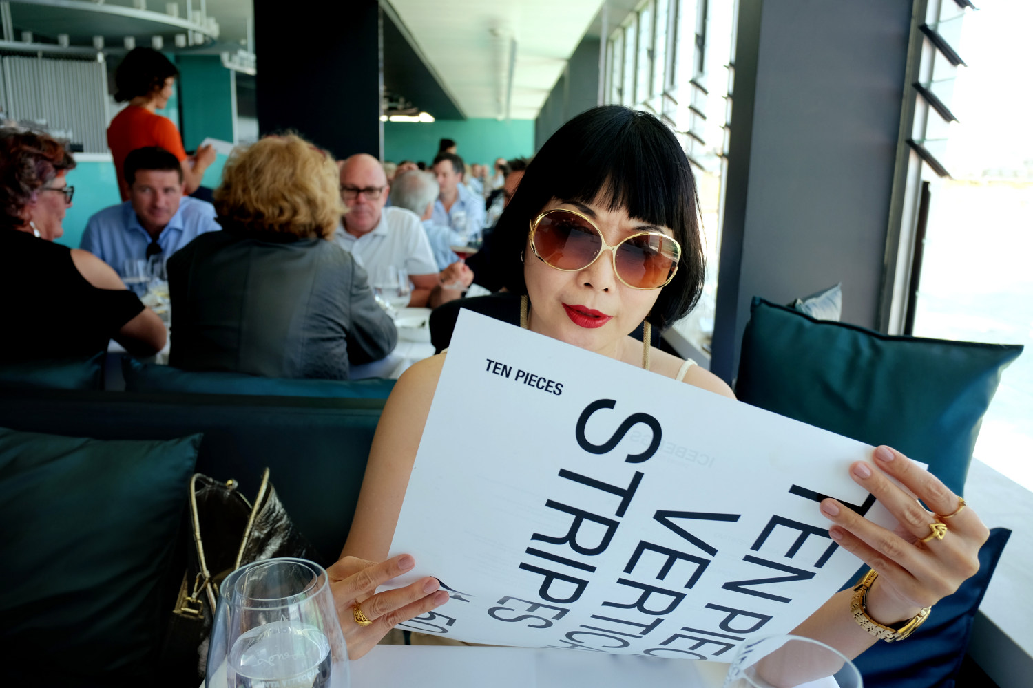 Checking out the menue, Icebergs Dining Room And Bar - Bondi Beach, Sydney, Australia.  Photography by Kent Johnson for White Caviar Life.