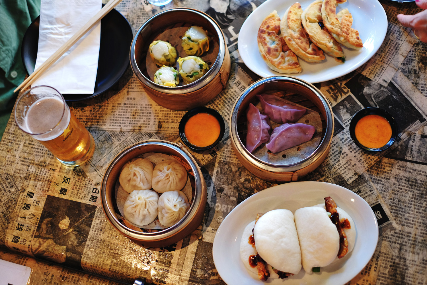Dim Sum, Xiao Long Bao; hot buns, dumplings; pancakes and Sapporo beer. Photography by Kent Johnson for White Caviar Life.