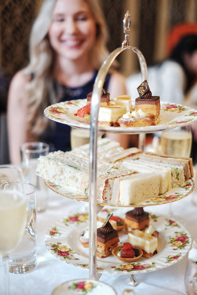 A three tier plate stand of sandwiches and sweets at Queen Victoria Tea Room - Sydney, Australia