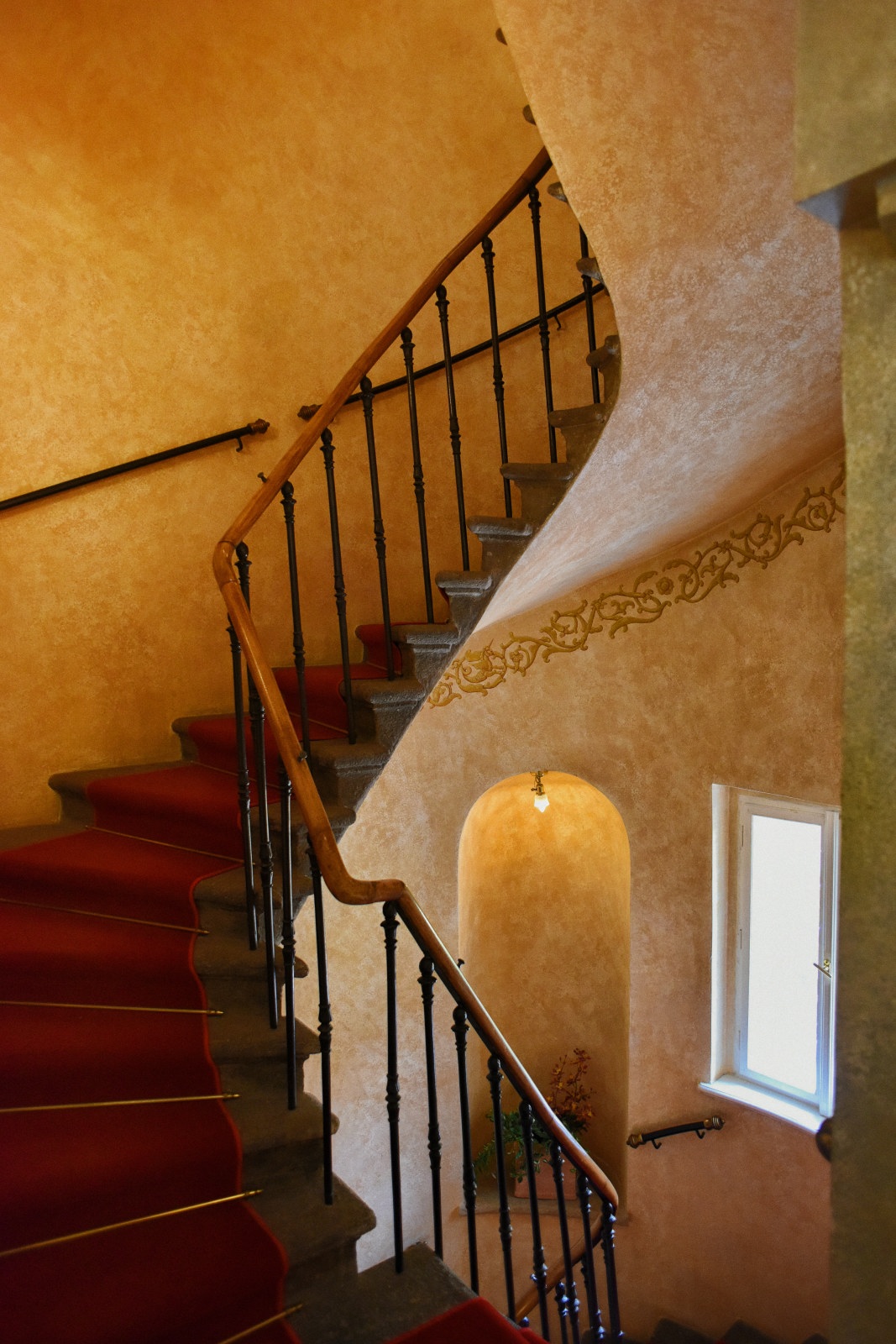 HView of a spiral staircase in a 15C hotel Alchymist Nosticova in Prague. Interior architecture photography by Kent Johnson.