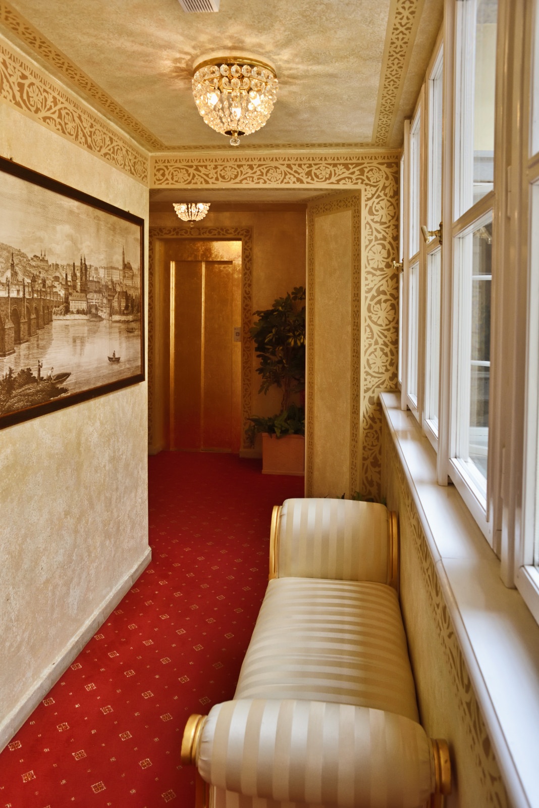 A luxurious loft room in Prague viewed though the reflection of an antique cheval mirror. Boutique Hotel & Lifestyle Photography, by Kent Johnson Photography