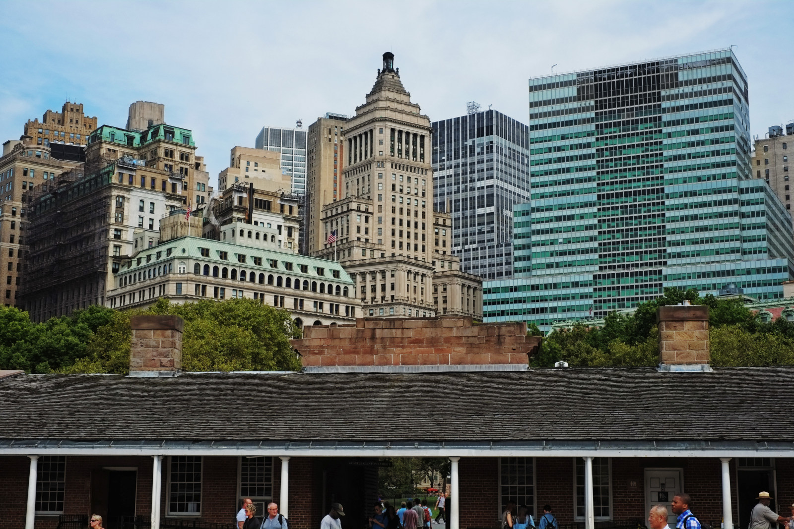 Inside Castle Clinton with art deco Manhattan Skyline as a New york City background