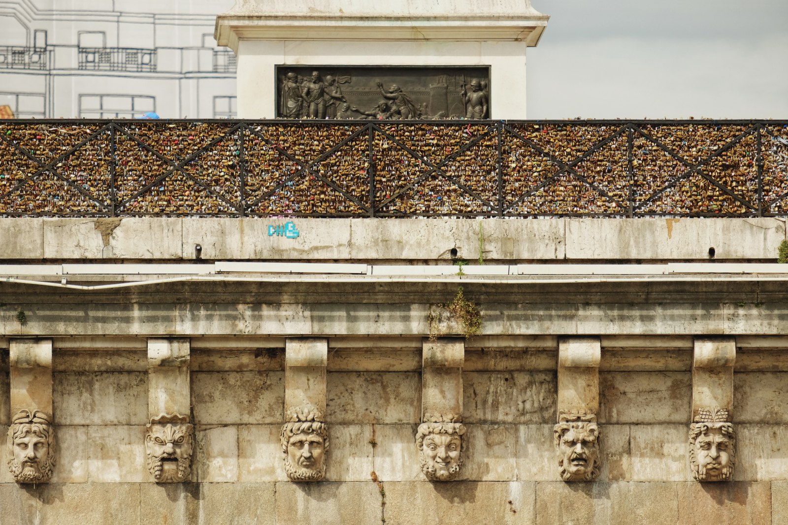 The beautiful Pont Neuf  Mascarons (Stone Masks) & 'Love Locks', Paris, France. Architecture, travel lifestyle photography by Kent Johnson.