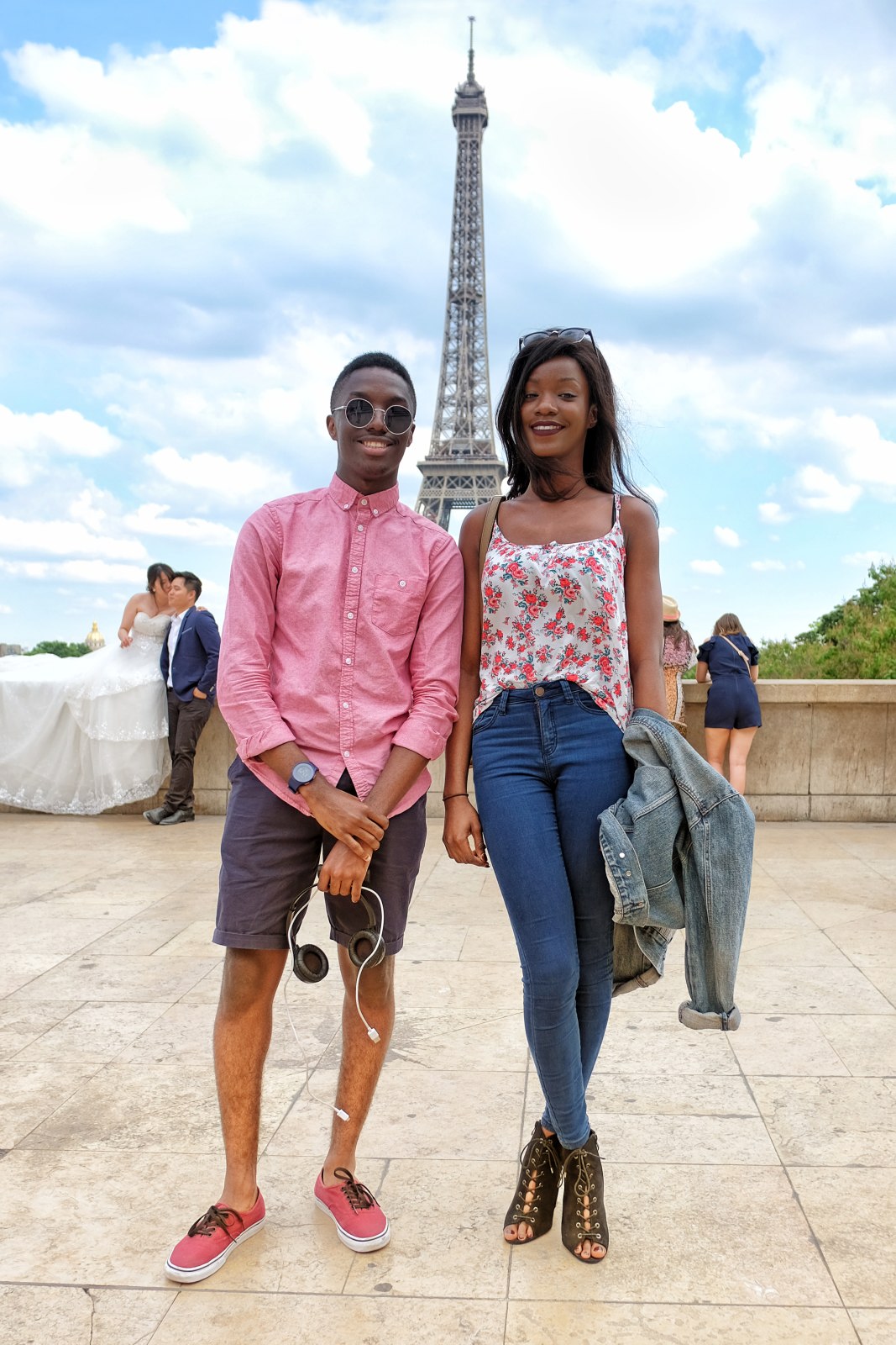 A young couple pose for Street Fashion Sydney at Place du Trocadéro with the Tour Eiffel. Travel photography by Kent Johnson.