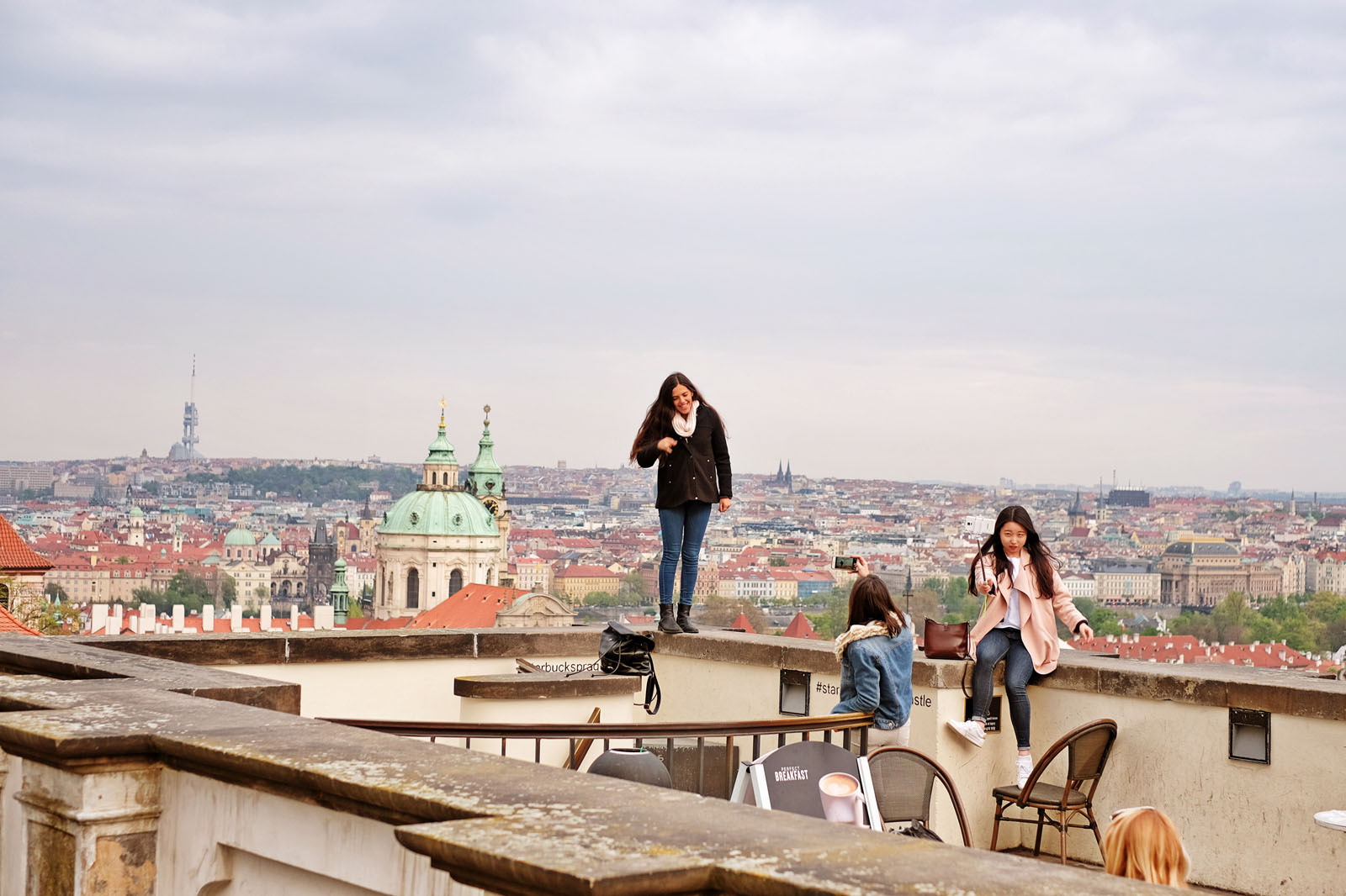 A selfie on high with Prague in the background, street style. Travel photography by Kent Johnson