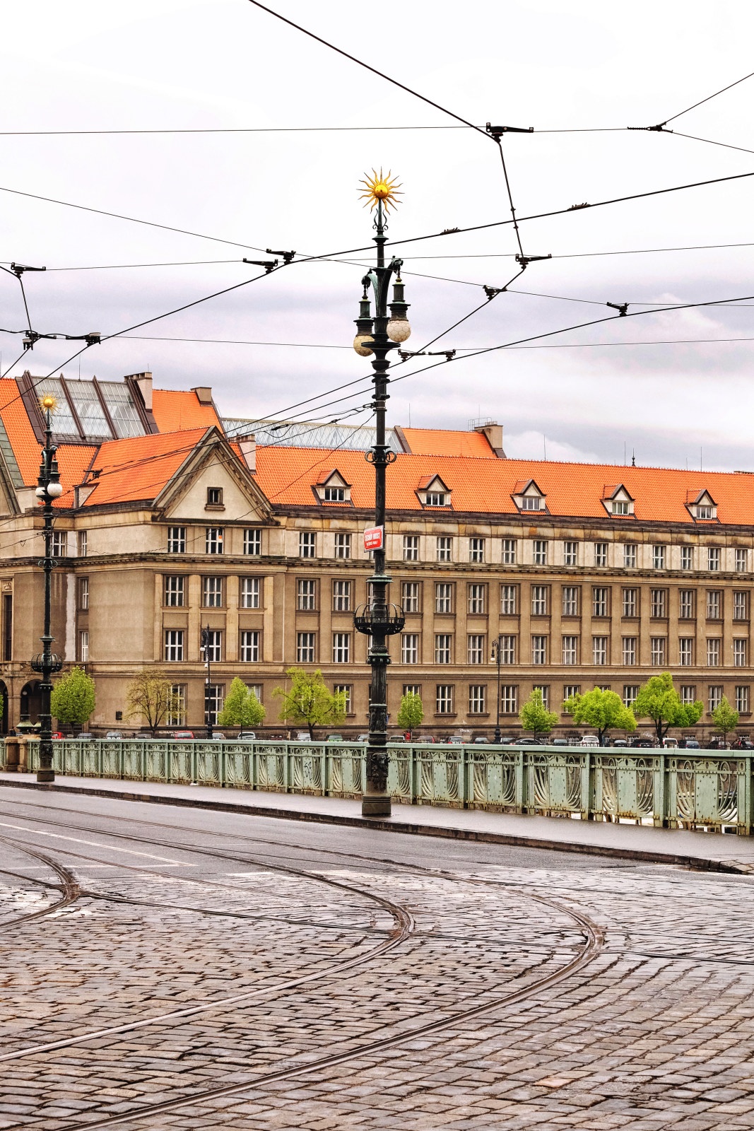 Art nouveau golden sun on a lamp post Čechův most, by architects Jan Koula and Jiří Soukup, circa 1905, Prague Czechia