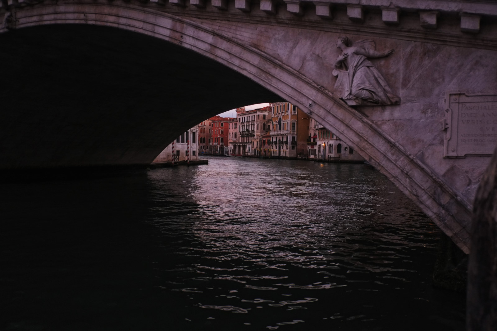 Grand Canal from under the arch of the Rialto Bridge at dawn.