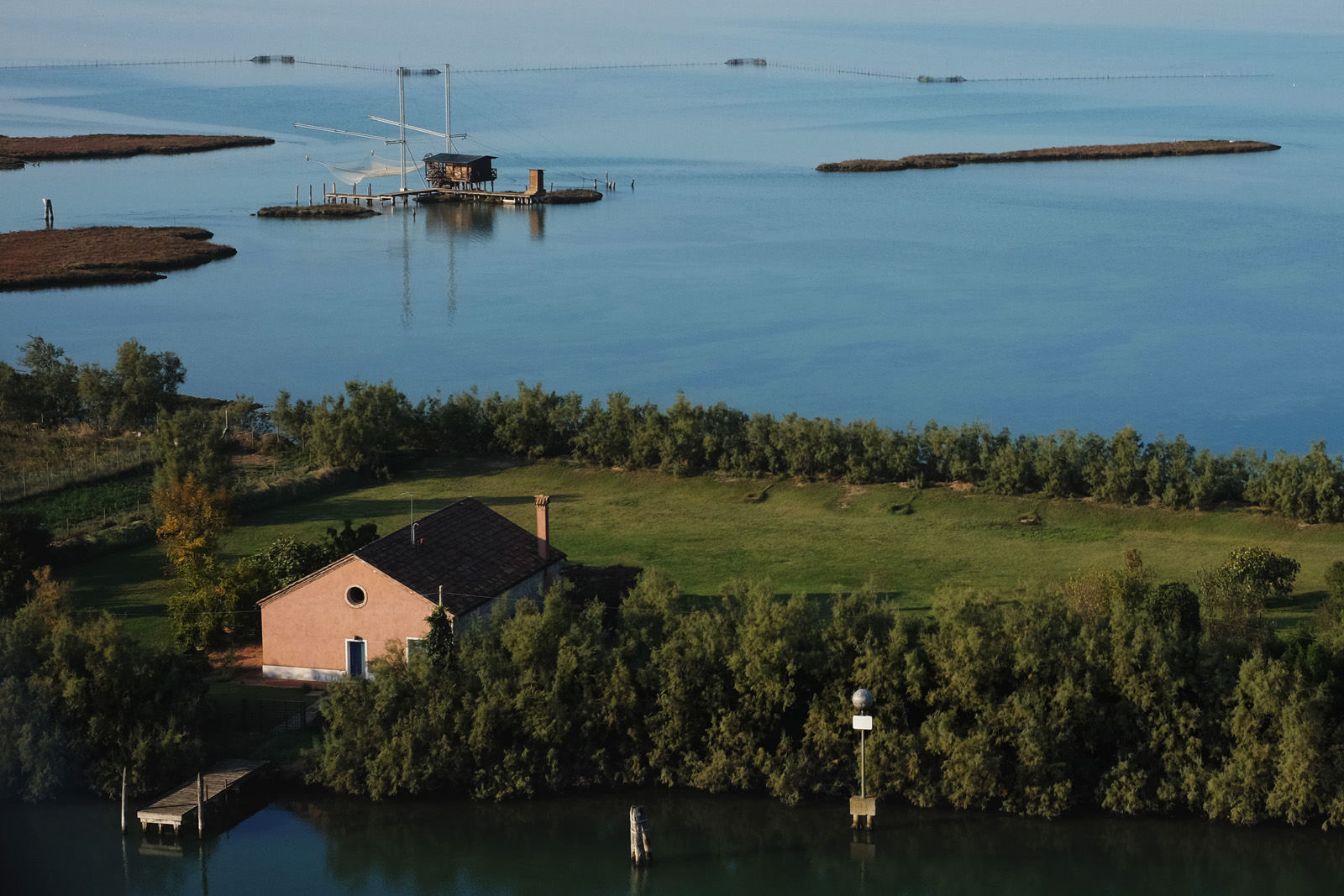 A net fishing house on the lagoon near Torcello, Venice. Travel Photography by Kent Johnson.