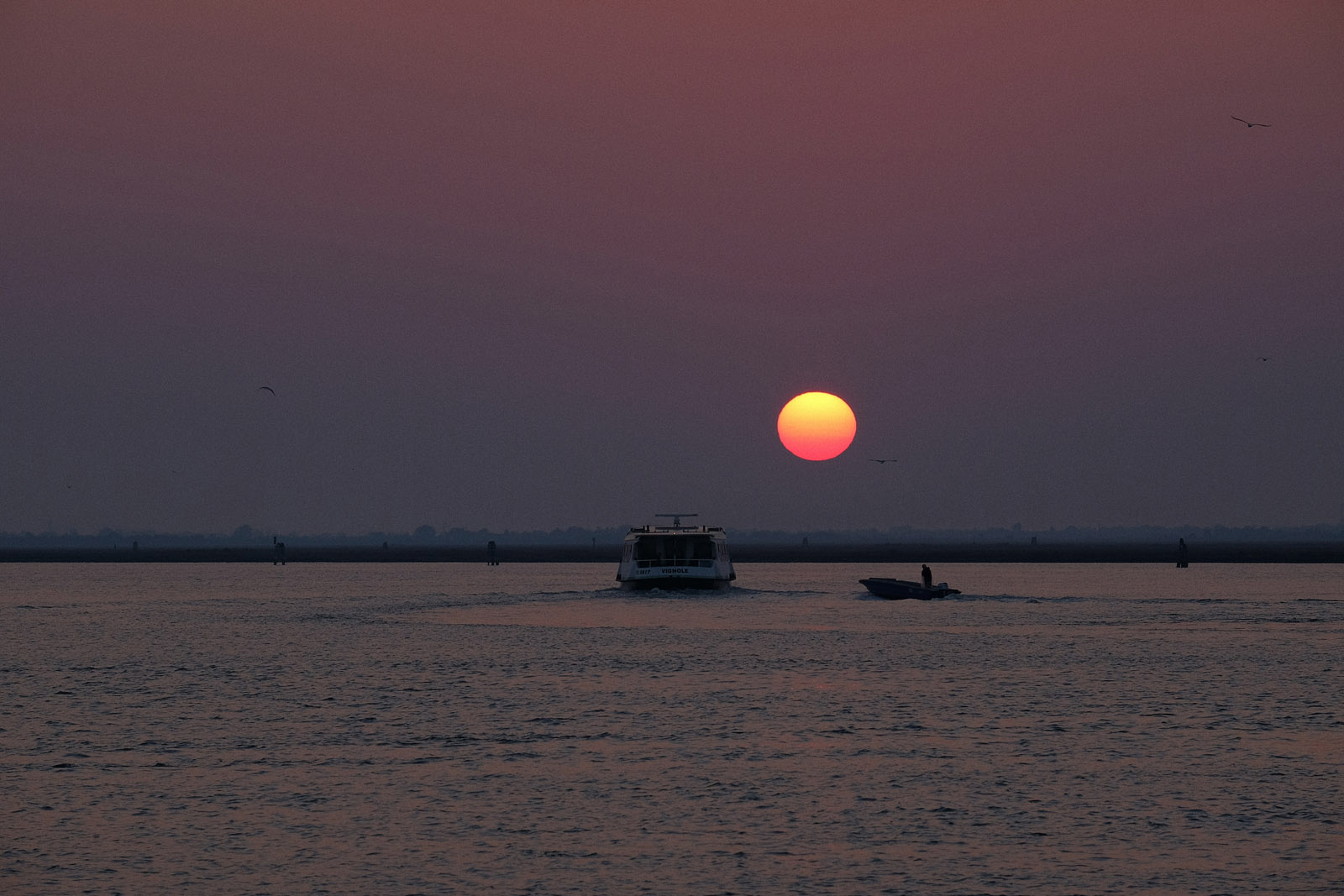 Sunrise over the Venice lagoon seen from Burano. Lifestyle photography by Kent Johnson.